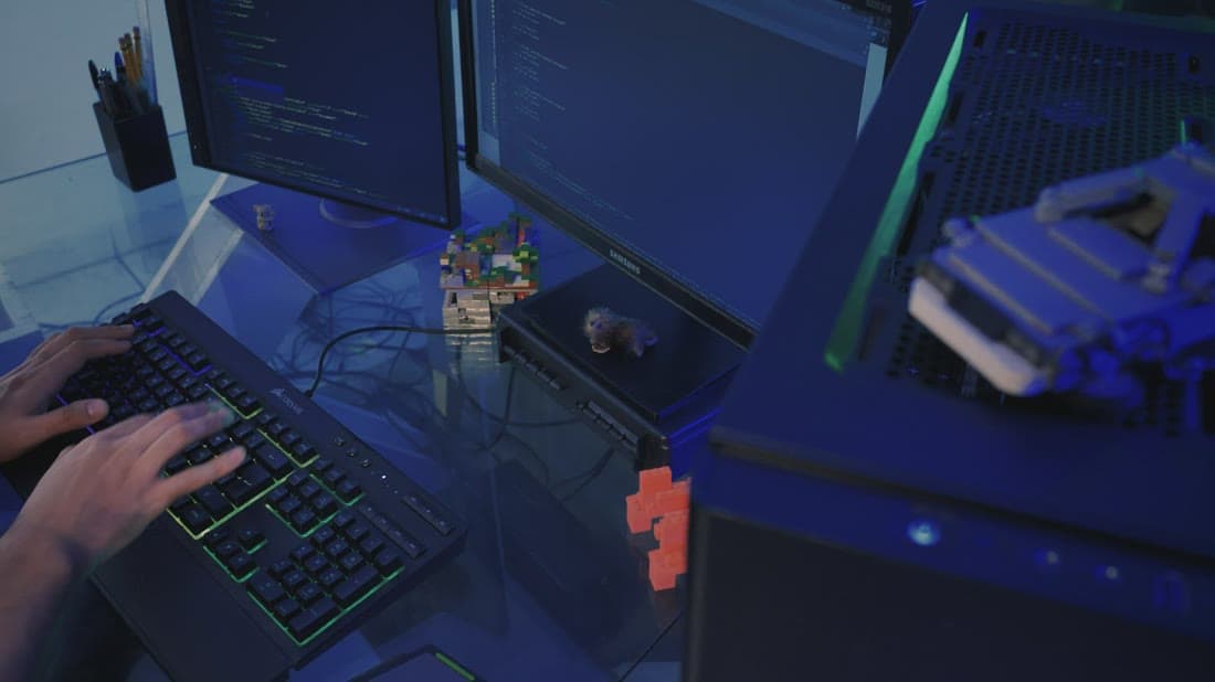 Web developer coding a responsive website on multiple screens