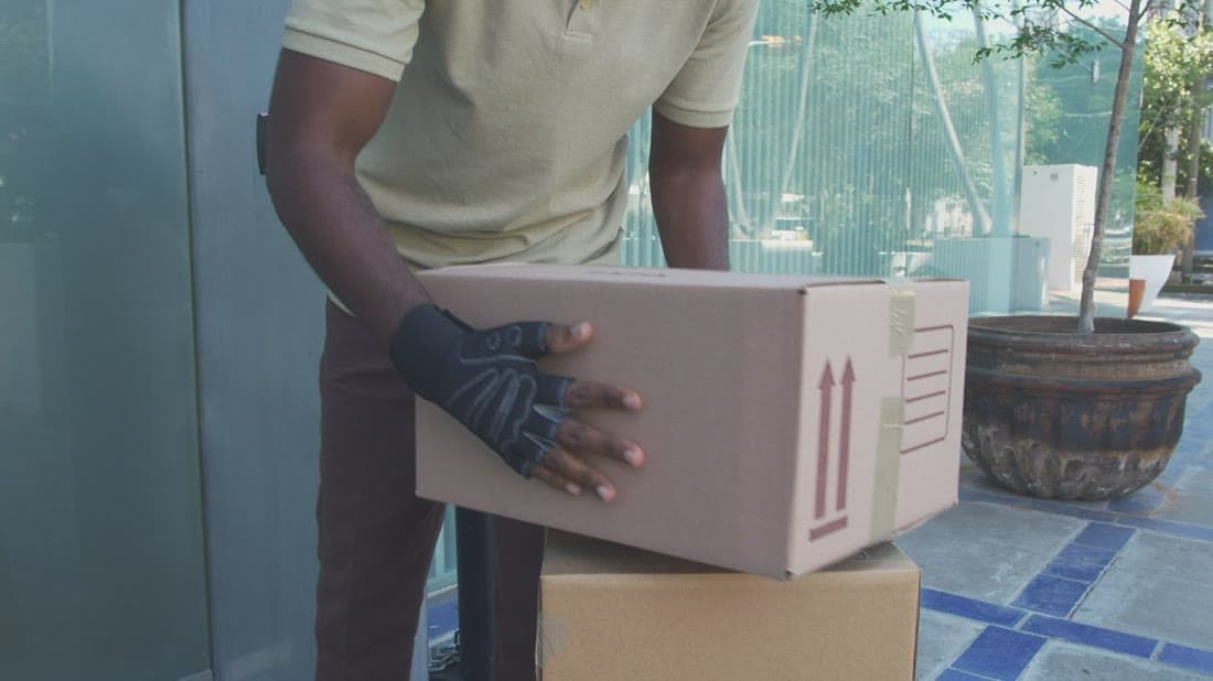 Courier delivering an online order package to a customer
