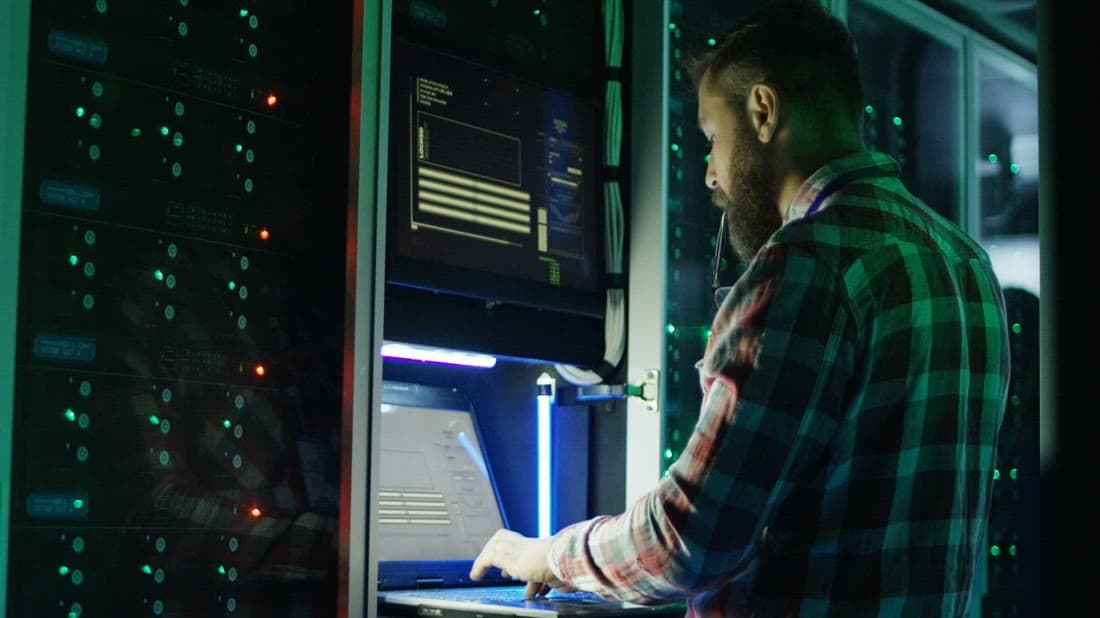 IT specialist managing hosting servers in a data centre