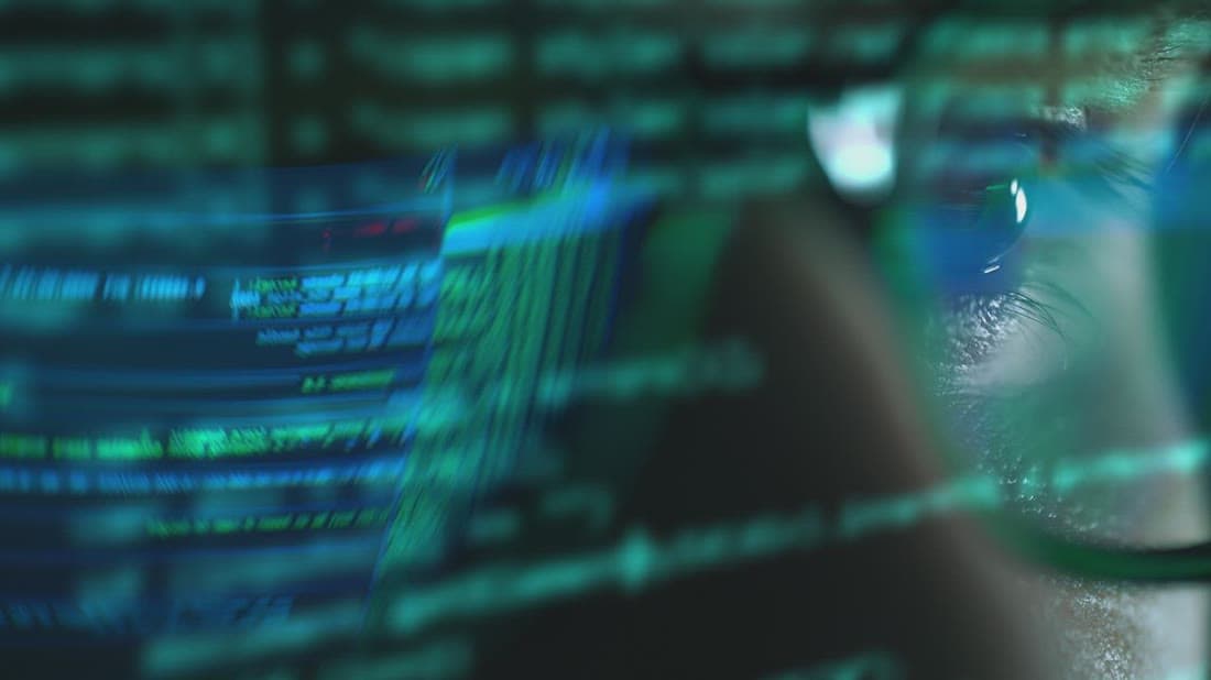 Software developer writing code for a custom business application